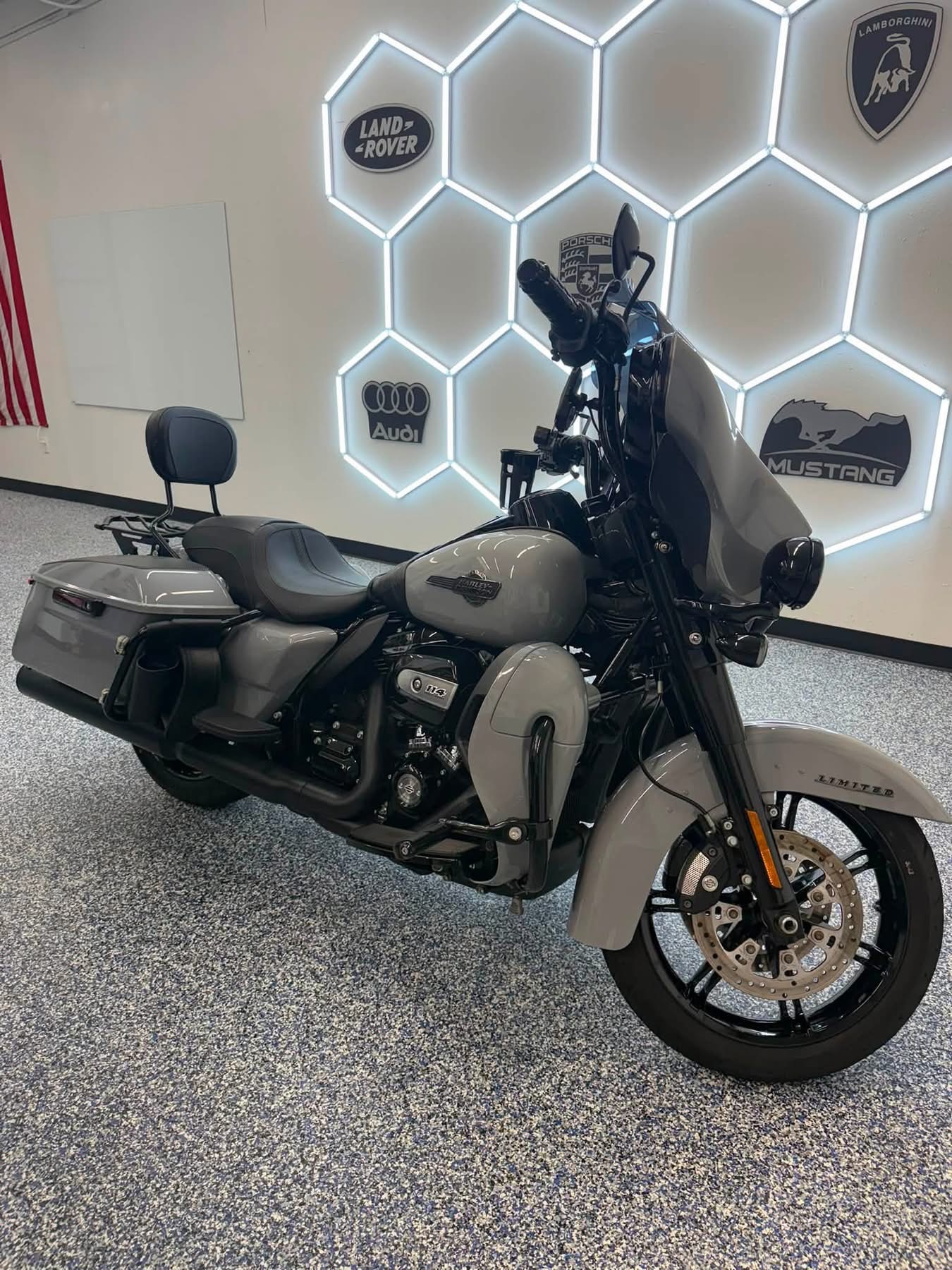 Gray Harley-Davidson touring motorcycle beneath the shop lights from the Clean Sweep Detailing portfolio
